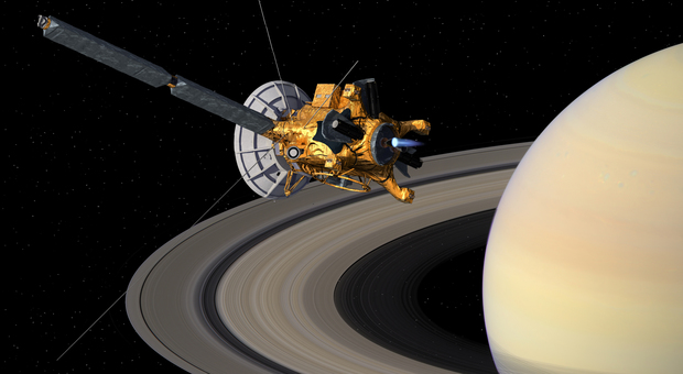 Una riproduzione artistica della sonda Cassini sugli anelli di Saturno